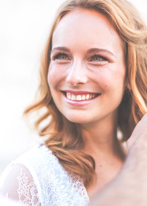 Smiling bride in a lace dress